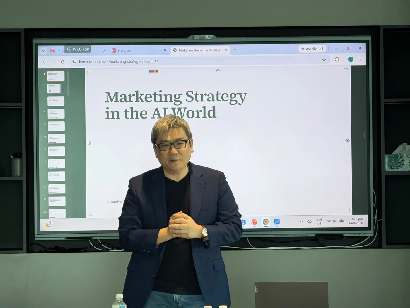 Dr Benson Soong speaking in front of a large display showing the opening slide, “Marketing Strategy in the AI World”.